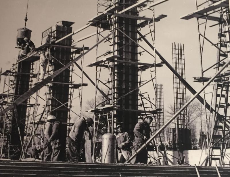 A photo from 1966 of workers building the frames for the LARTS building on campus. COURTESY CLAIRE T. CARNEY LIBRARY ARCHIVES AND SPECIAL COLLECTIONS